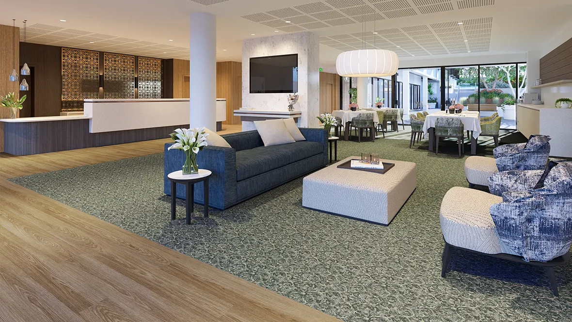 Carpeted aged care lounge with warm, natural finishes
